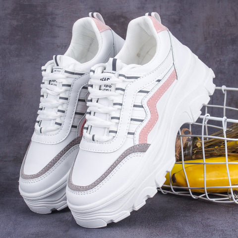 Small white shoes with thick soles