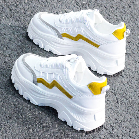 Small white shoes with thick soles