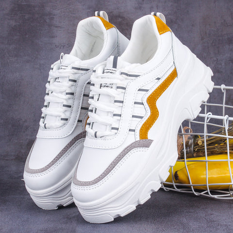 Small white shoes with thick soles